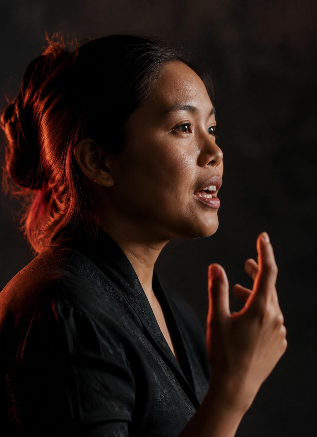 A woman speaking with conviction